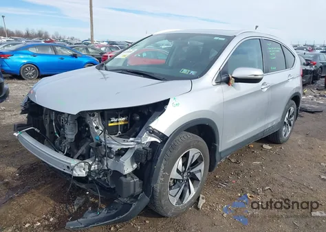 2016 Honda Cr-V Touring z USA, uszkodzony, nr VIN 5J6RM4H96GL119261
